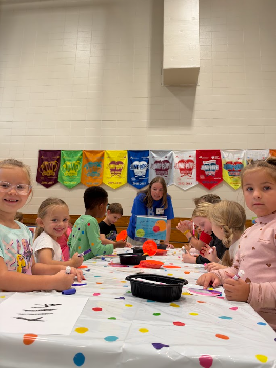 Kindergarten participating in activities in the gym during UNITE day