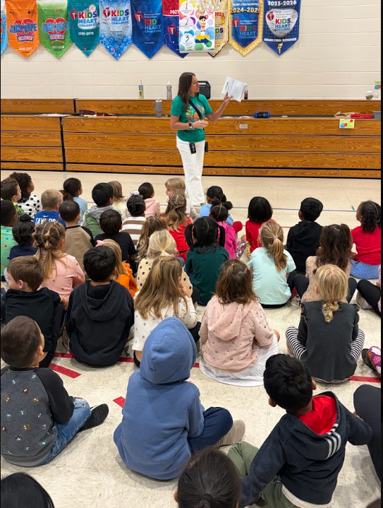 Kindergarten participating in activities in the gym during UNITE day