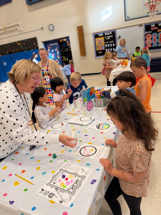 Kindergarten participating in activities in the gym during UNITE day