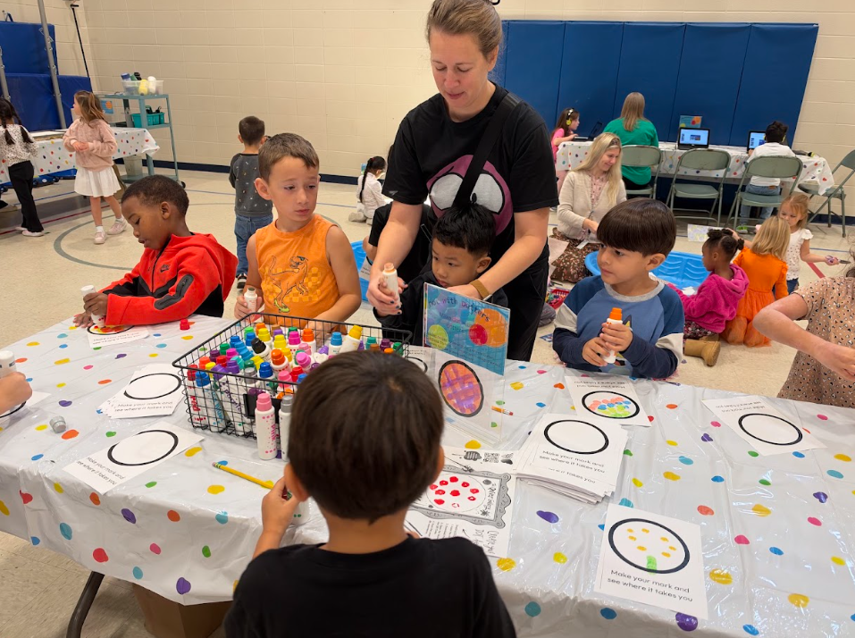 Kindergarten participating in activities in the gym during UNITE day