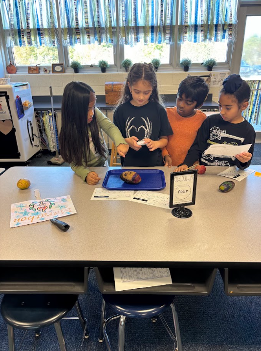 students decorating their potatoes for Potato Olympics