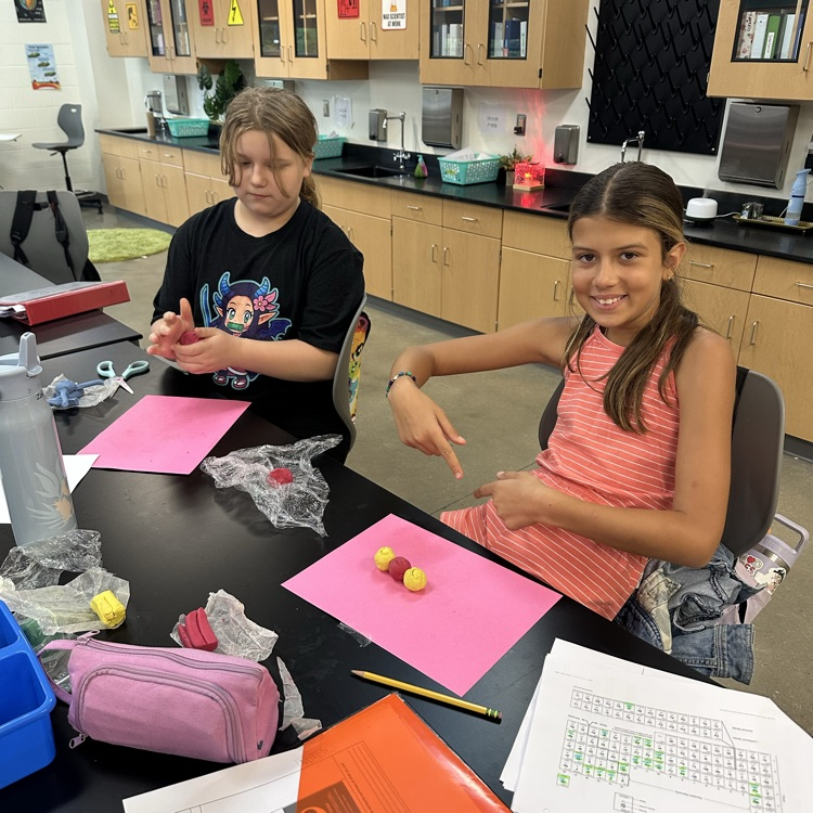 Students constructing atoms 