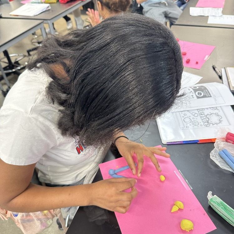 Students constructing atoms 