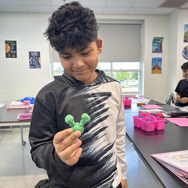 Students constructing atoms 