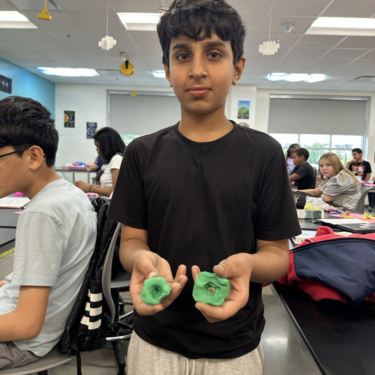 Students constructing atoms 