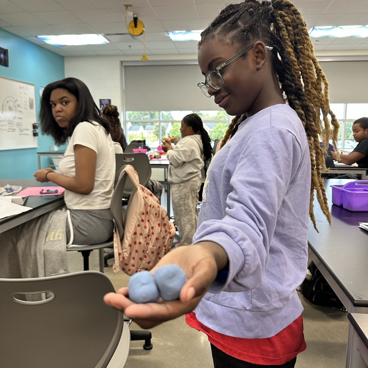 Students constructing atoms 