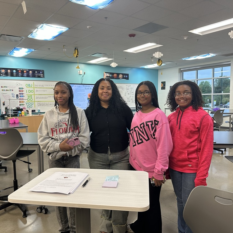 Ms. Smith poses with students for Back to School night! 