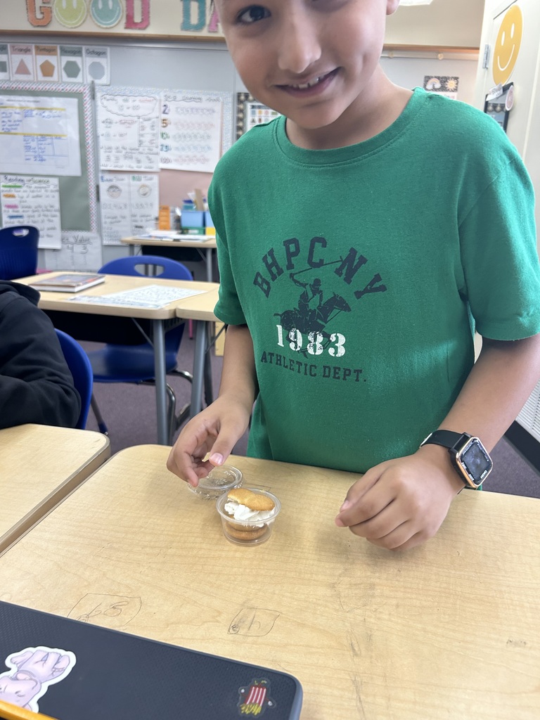 Students showing the pie he made