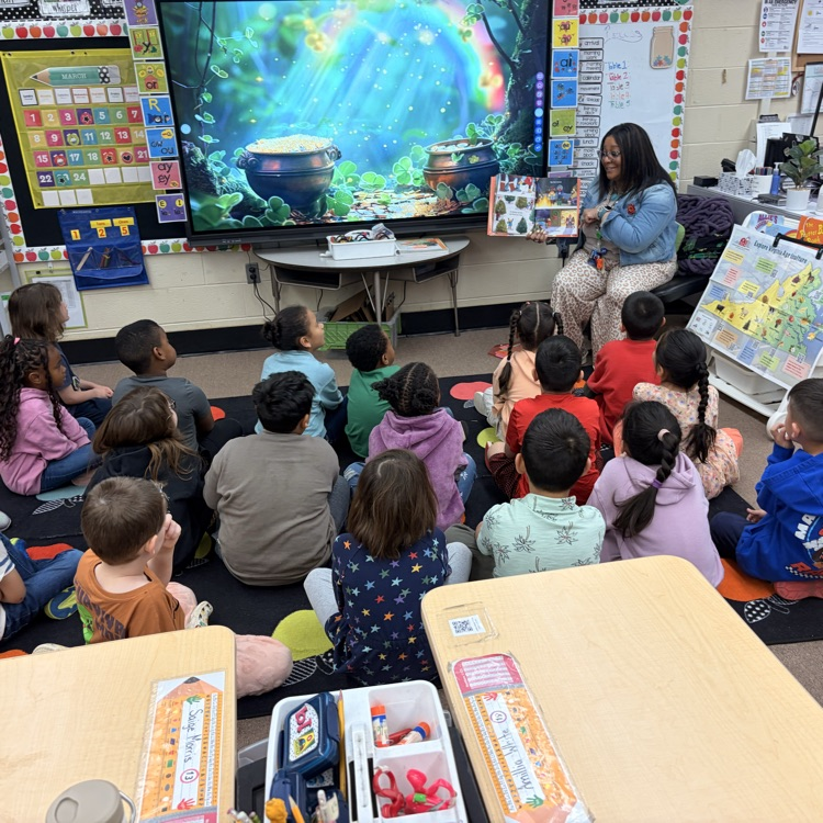 Mrs. Lewis reads to the kids  