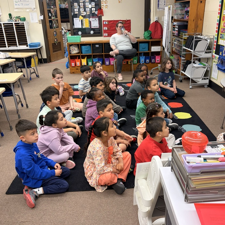 students listening to a story and instructions 