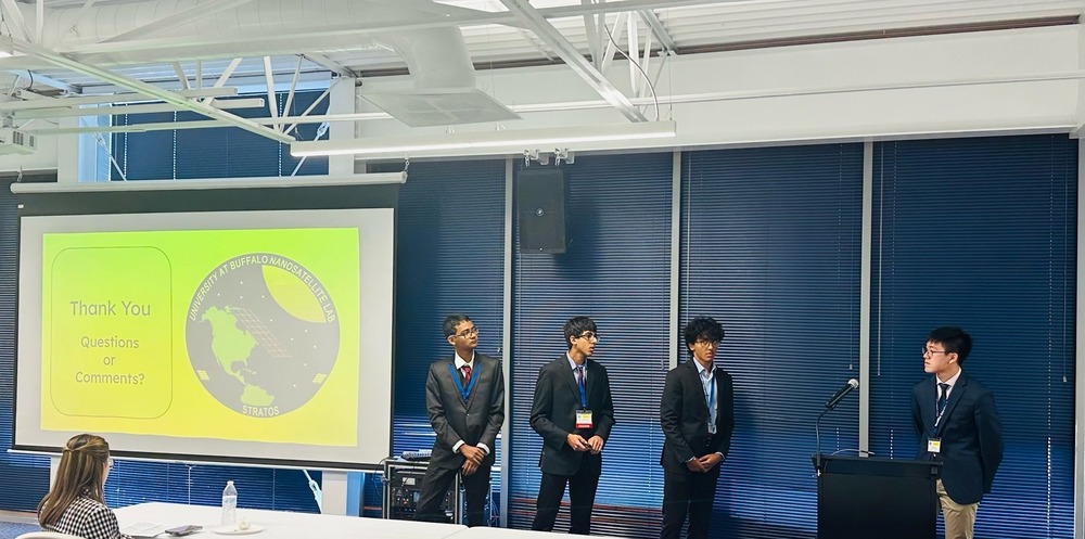 FHS Senior Neshwan Arif (second from right) presents with others at NASA