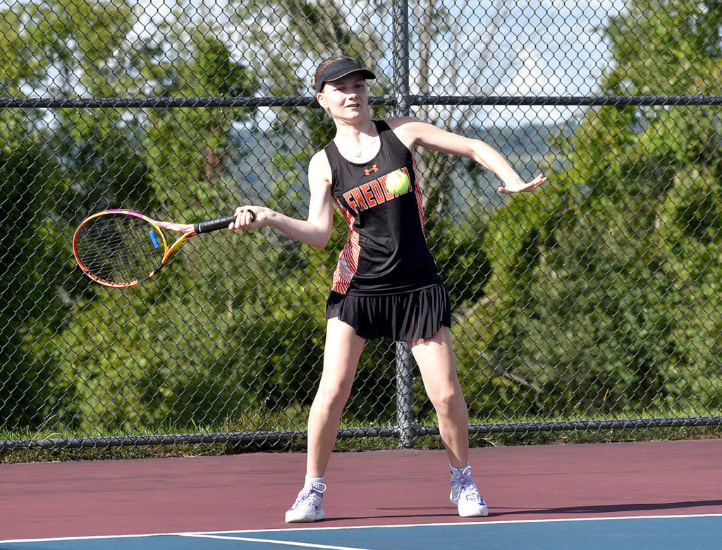 OBSERVER Photo by Matt Spielman Fredonia’s Nella Darrell-Sterbak hits a return during first singles action against Frewsburg/Southwestern on Tuesday in West Ellicott.