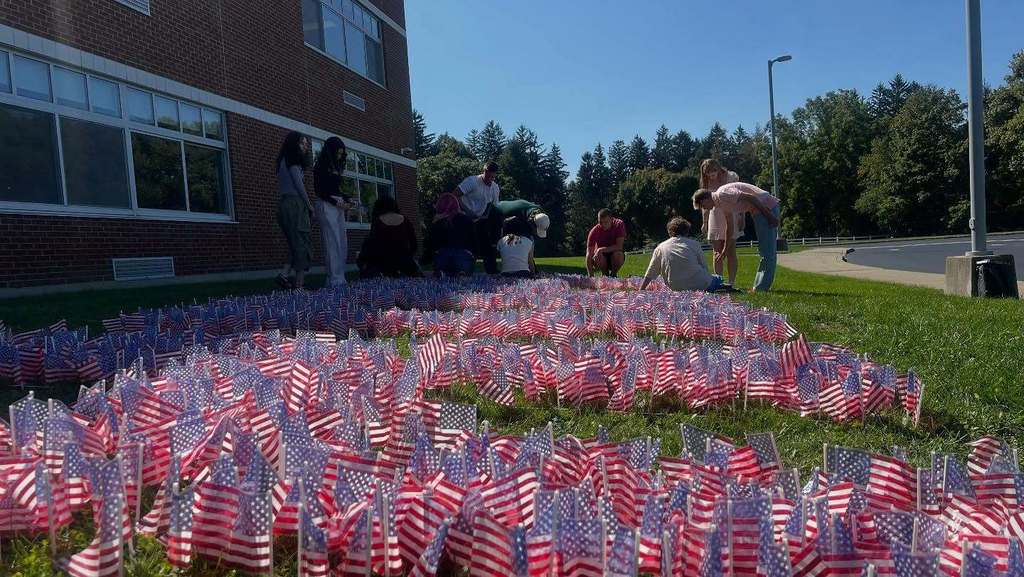 Students place 2,997 American flags spelling HOPE in honor of the lives lost on 9-11-2001.