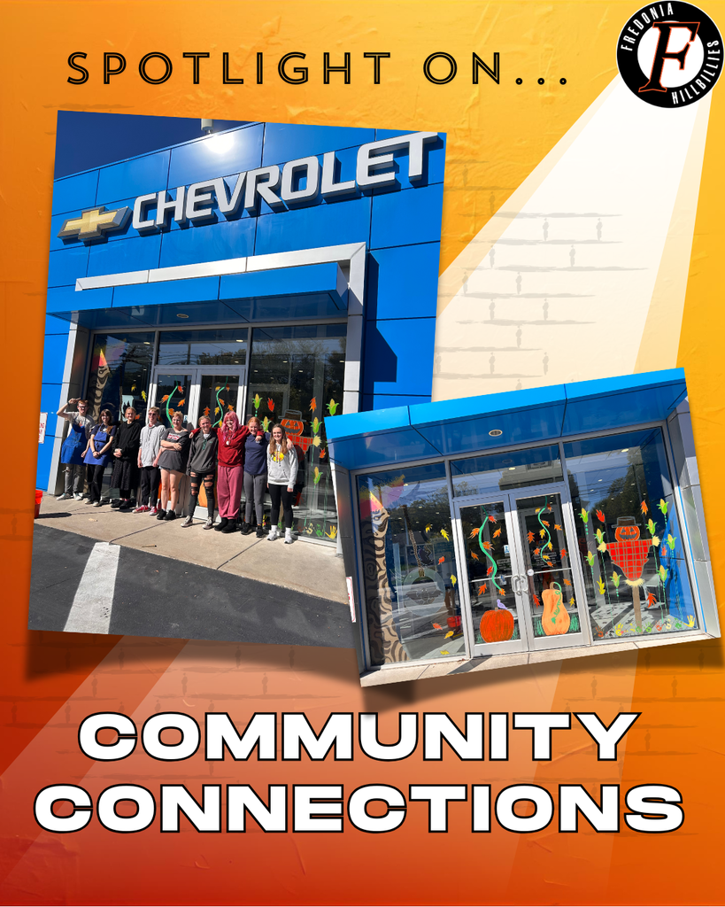 FHS Art students painting fall scenes on the Basil Chevrolet windows.