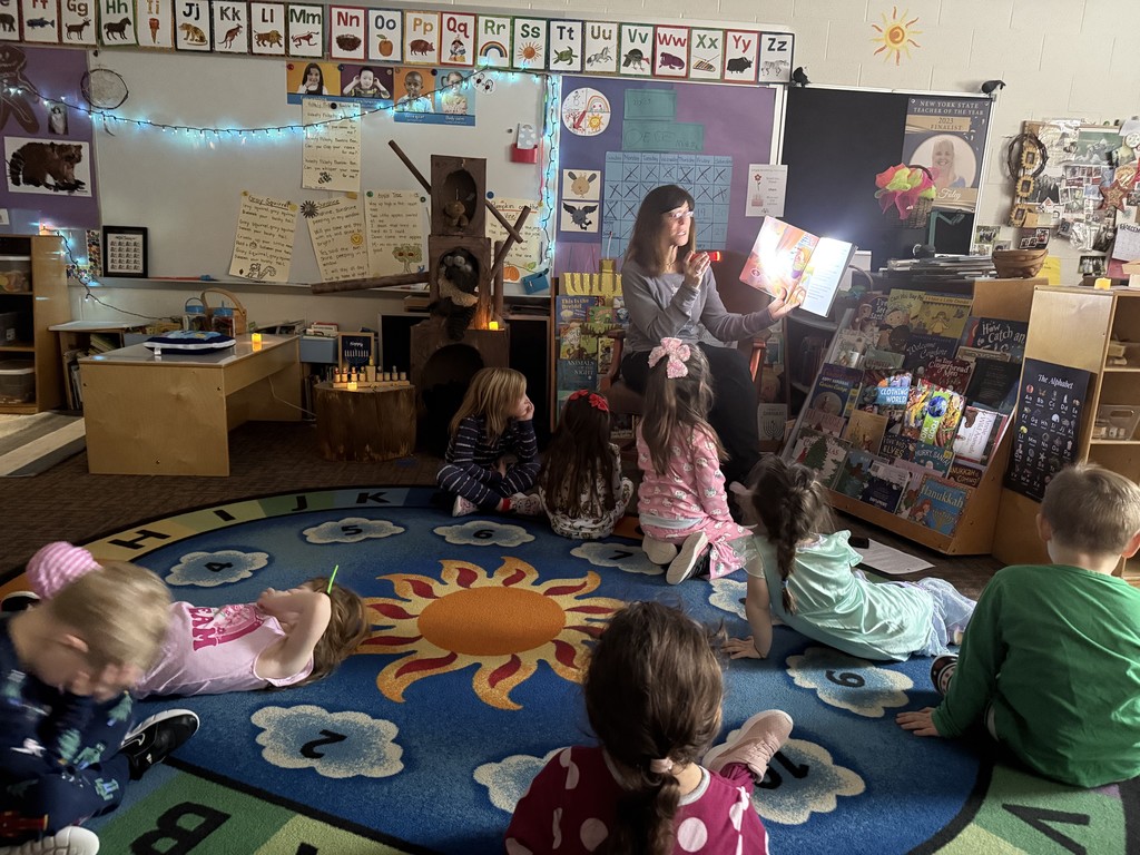 Storytime by flashlight during the Winter Solstice party.