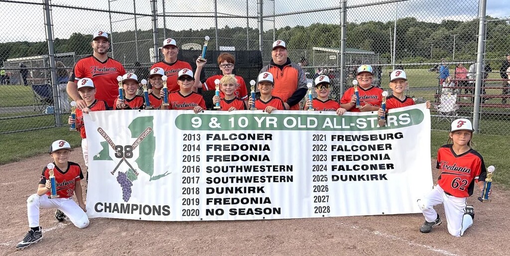 Fredonia 9-10 yr. old All-Stars posing with the champion banner.
