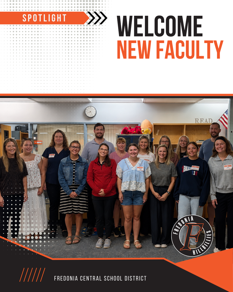 New faculty pose together in the Intermediate Library.