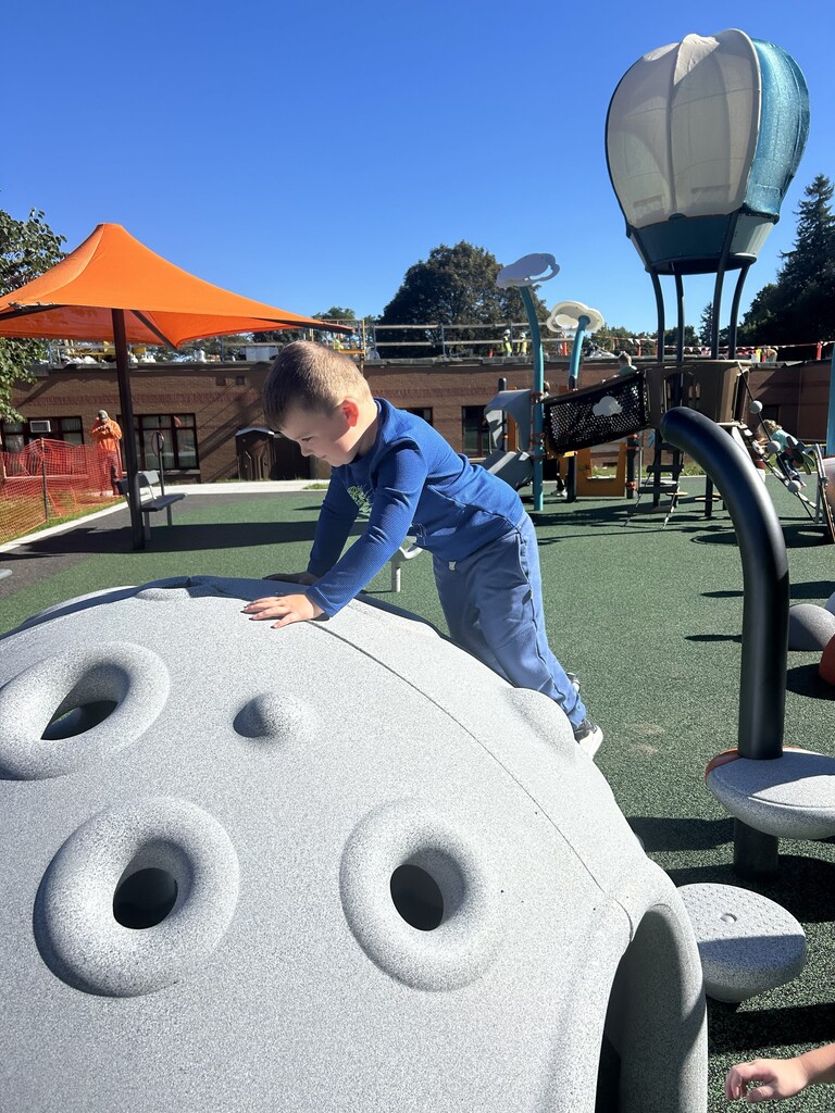 Wheelock students playing on the newly completed Chestnut St. playground for the 1st time.