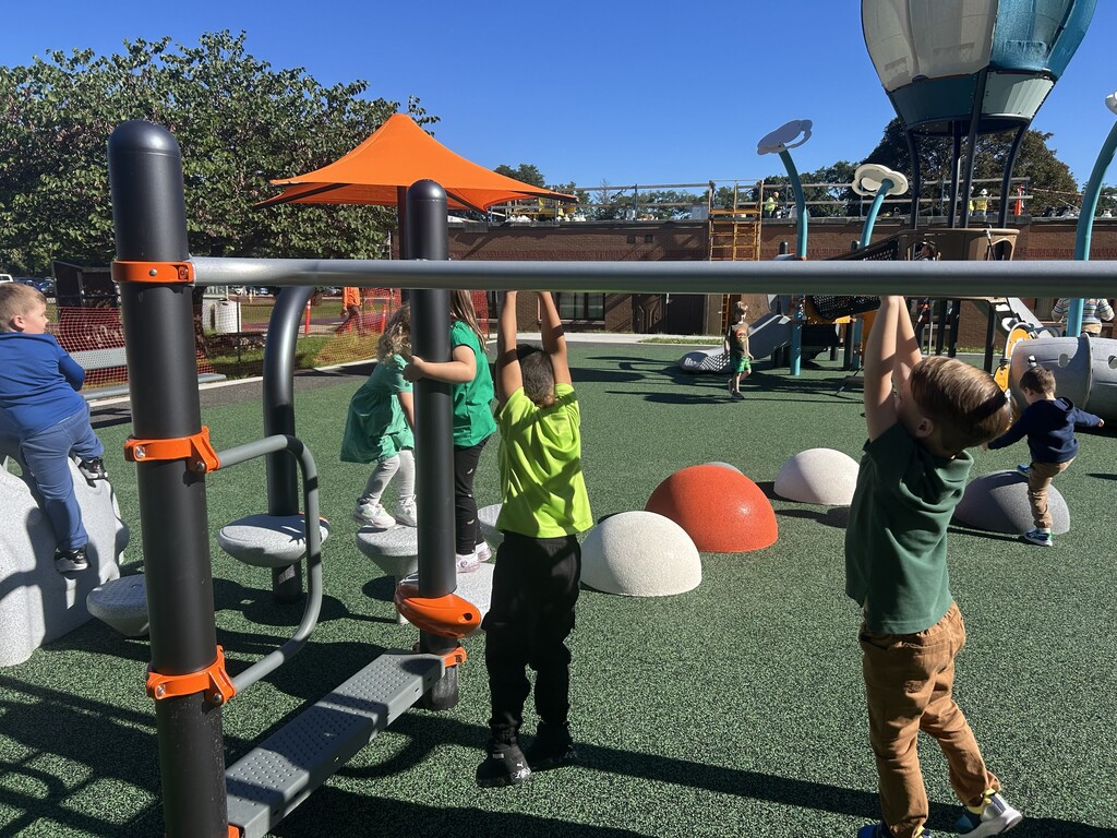 Wheelock students playing on the newly completed Chestnut St. playground for the 1st time.