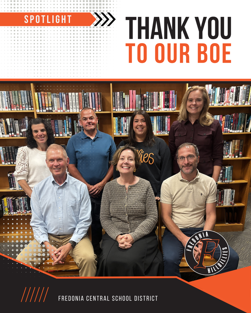 Group photo of the current Board of Education in the library.