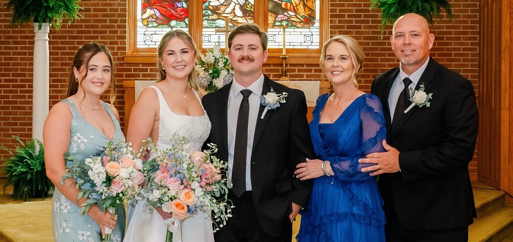 Man stands with family