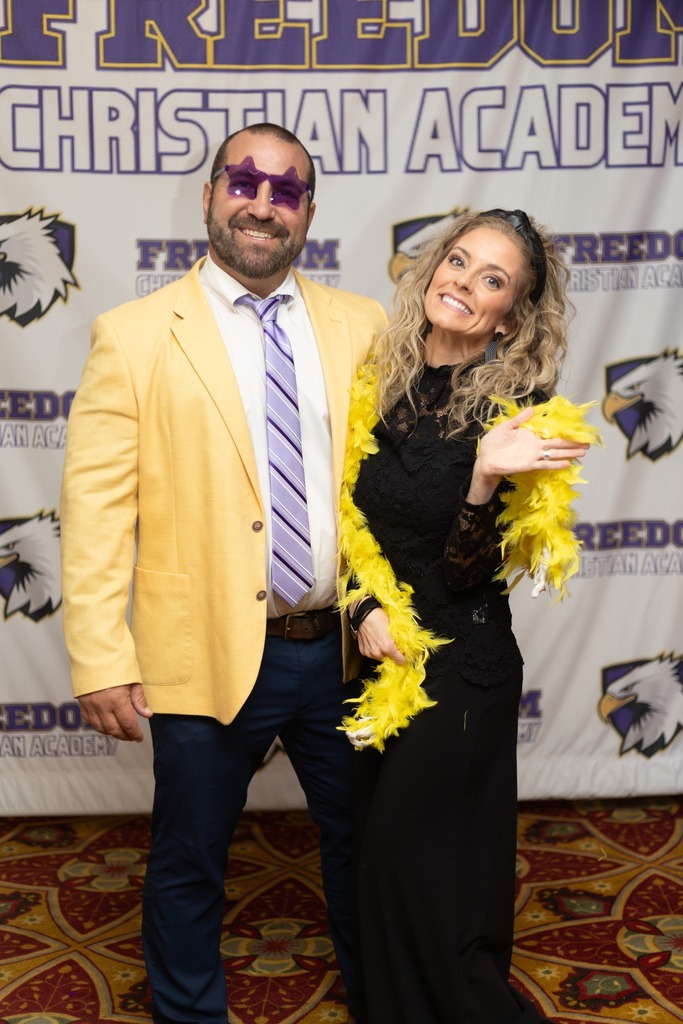man and woman posing for photo