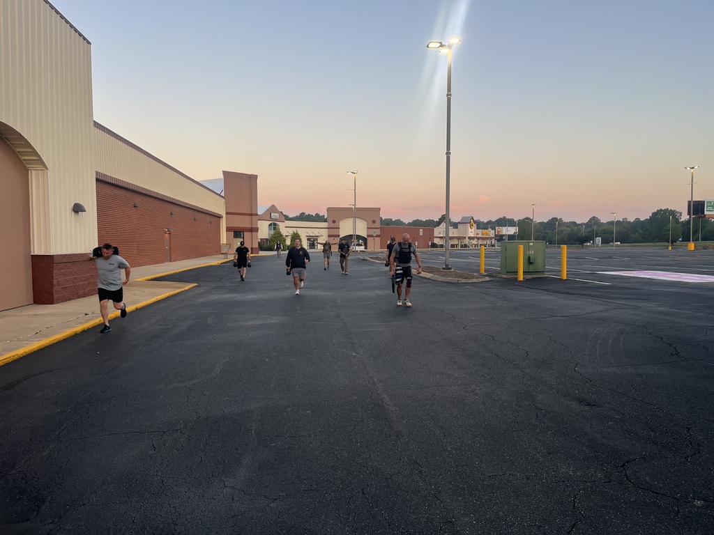 Men walking at sunrise