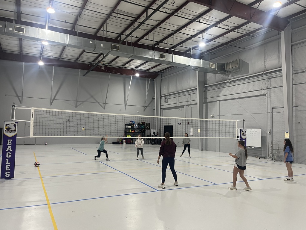 students playing volleyball