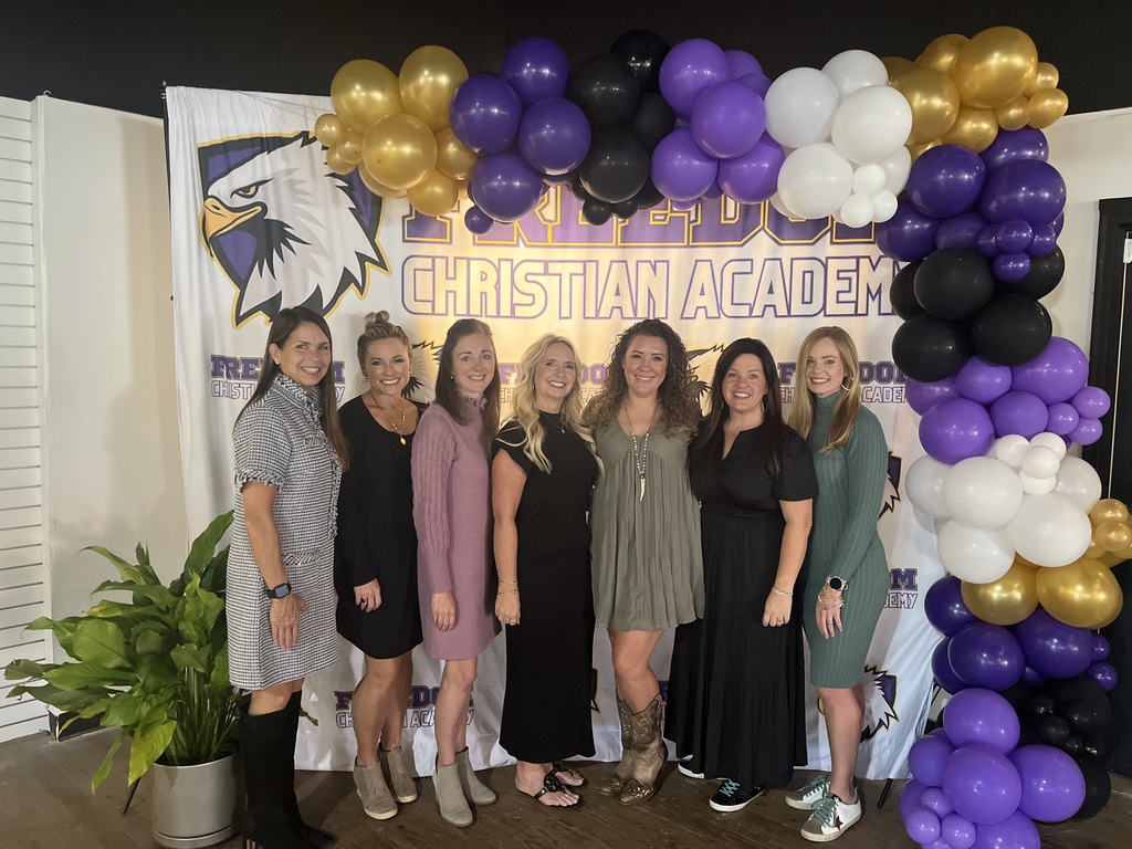 Fundraising committee members stand together