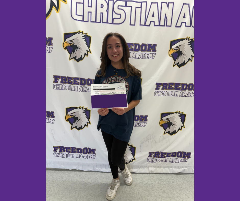 Student holding driving certificate