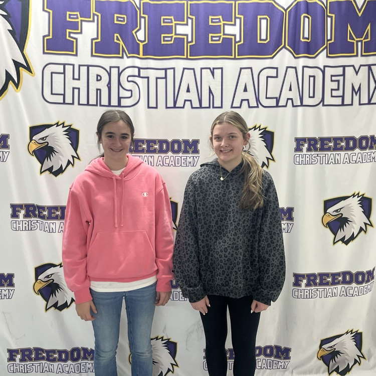 2 girls receiving drivers education certificates 