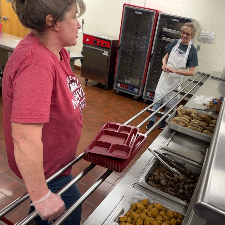 Deb and Sue getting ready to serve