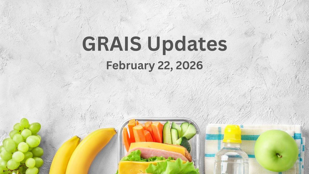 An assortment of fruit and a water bottle.