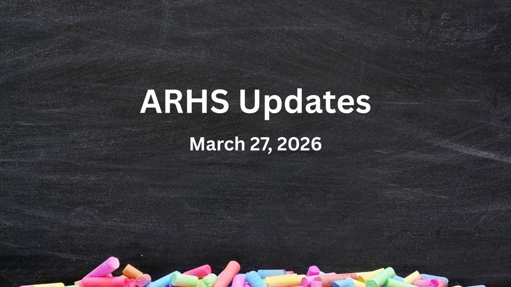 Colorful chalk pieces against a chalkboard.