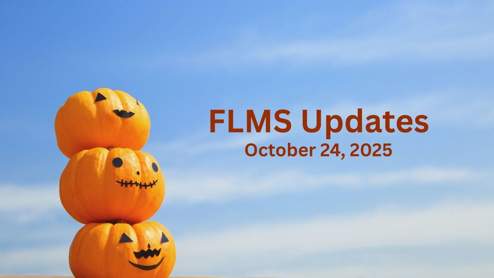 Three jack-o-lanterns against a bright blue sky.