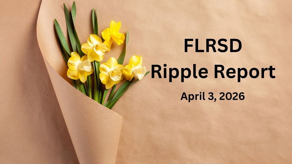 Five yellow daffodils wrapped in brown paper.