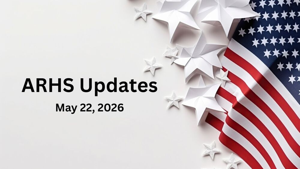An American flag and white paper stars.