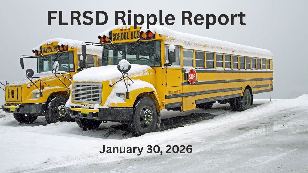 Two school buses covered in snow.
