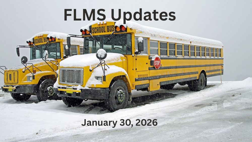 Two school buses covered in snow.