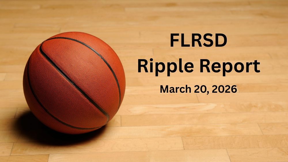 A basketball on a wood plank floor.