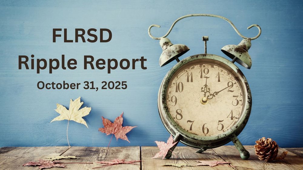 An antique old fashioned alarm clock and autumn leaves.