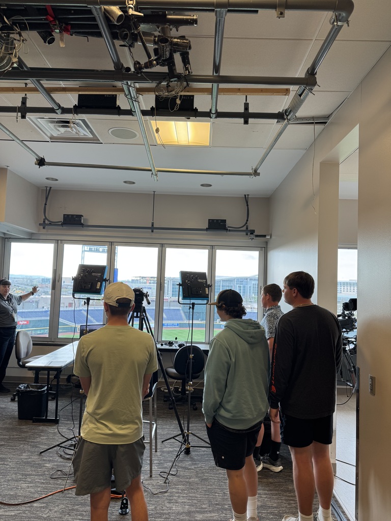 Students listening to instruction at baseball field in Omaha