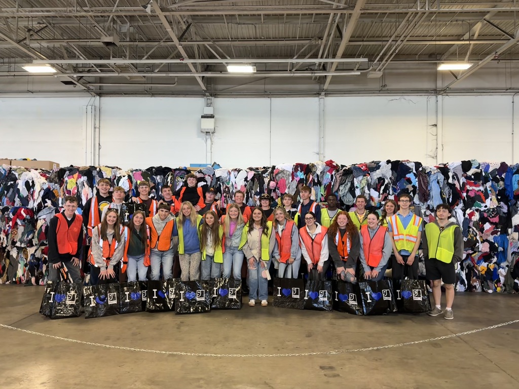 Group of students posing on field trip to Goodwill