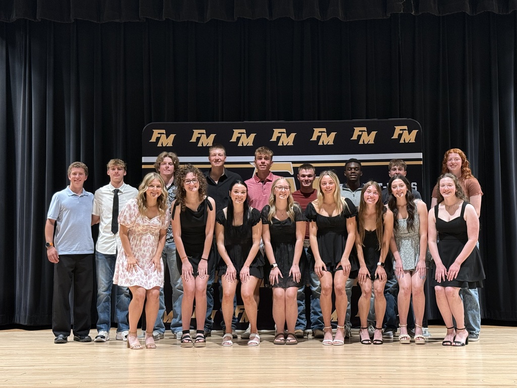 Group of seniors posing on stage at Senior Award Night