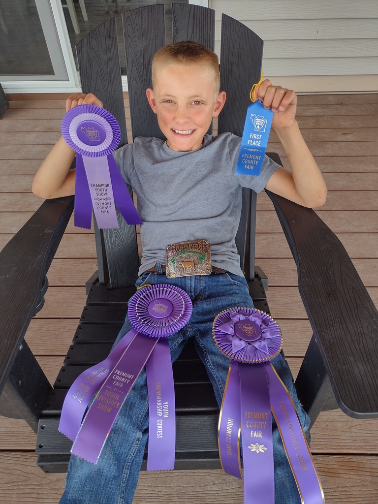 Joseph Place with ribbons from the fair.