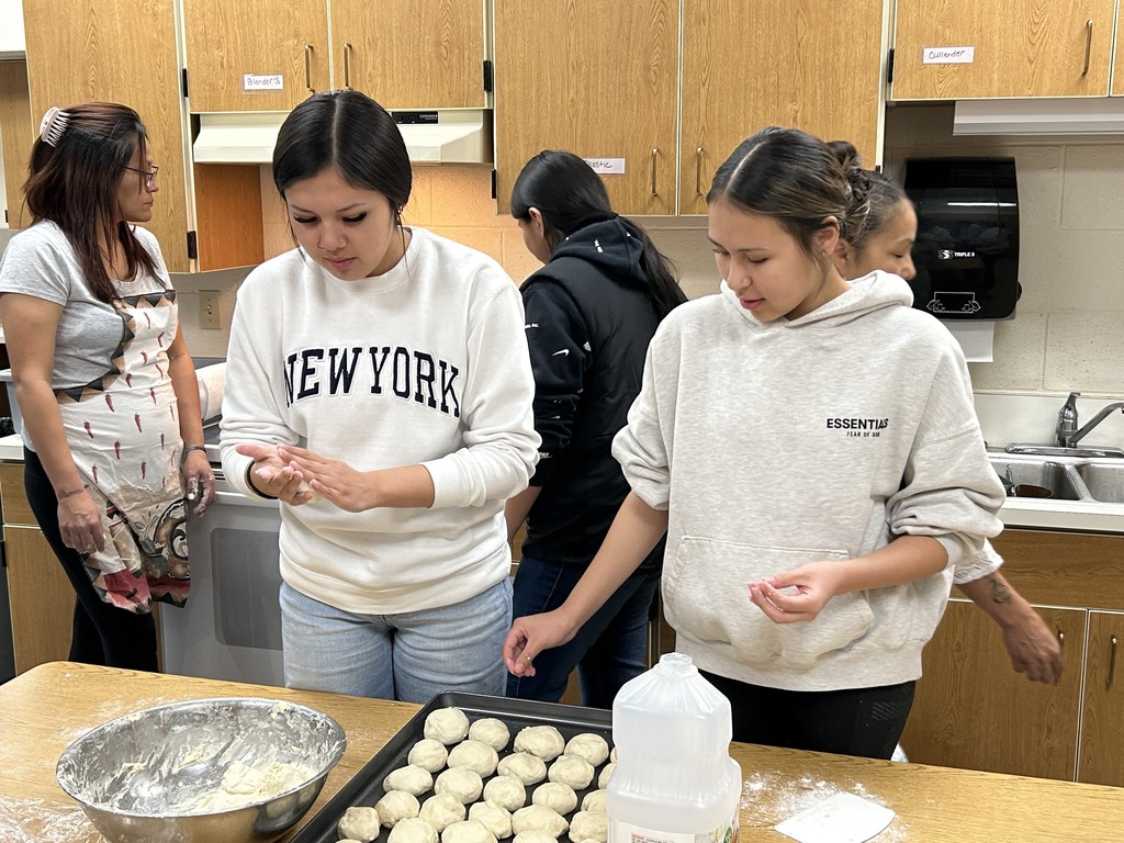 Tanyah and Atavia making fry bread
