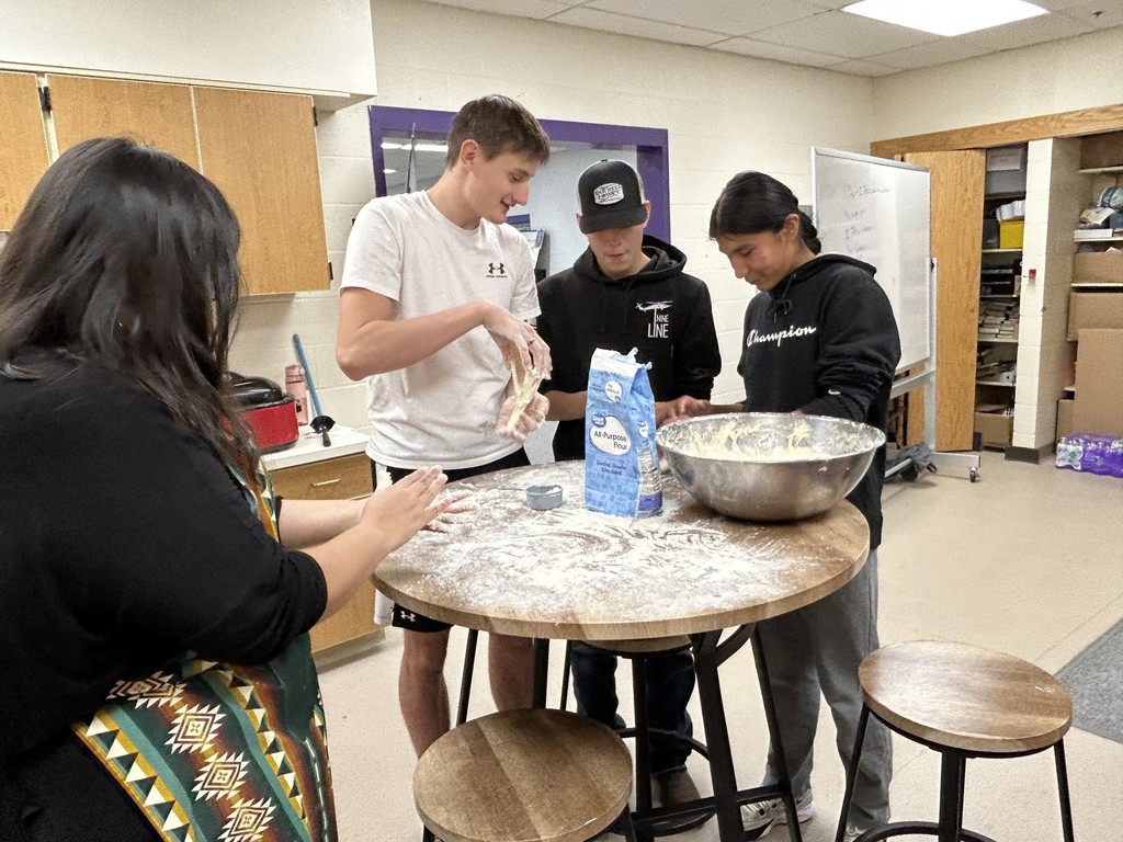 Josh, Aiden, and Glorian making fry bread