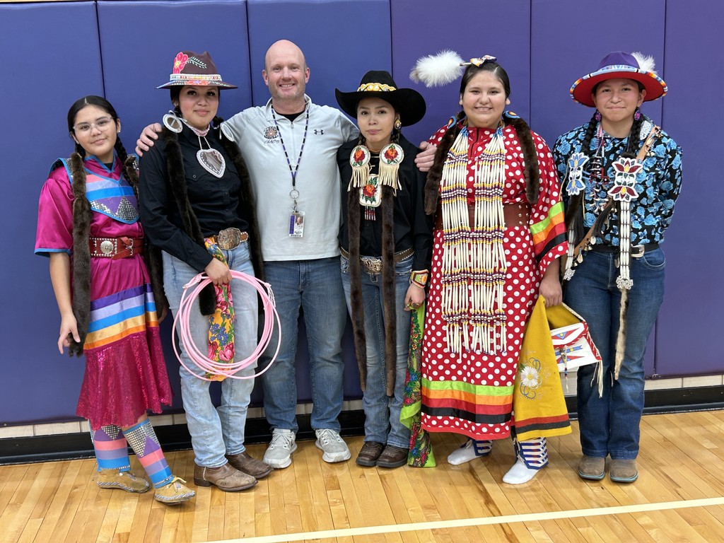 Mr. Walker with Celene, Tanayah, Natiya, Natayah, and Morning in regalia
