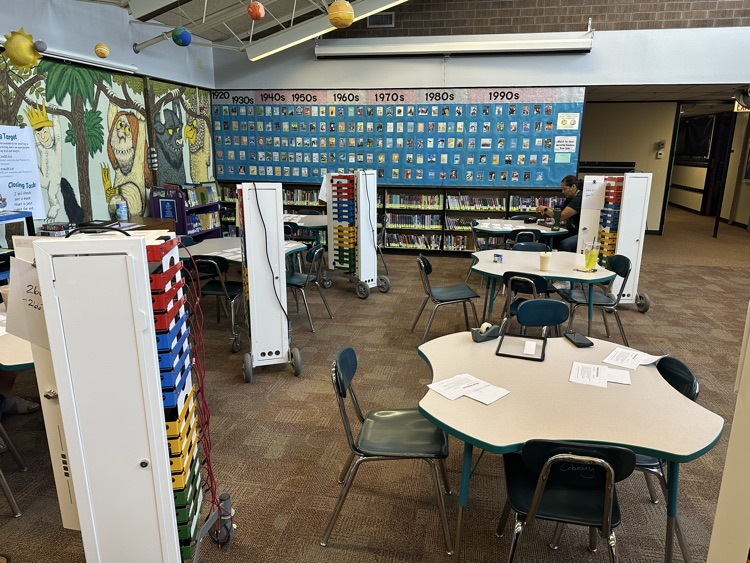 Chromebook carts around tables in library