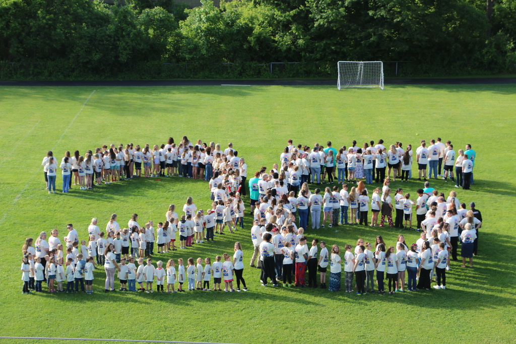 School Photo of all Students and Staff (Back of Shirt)